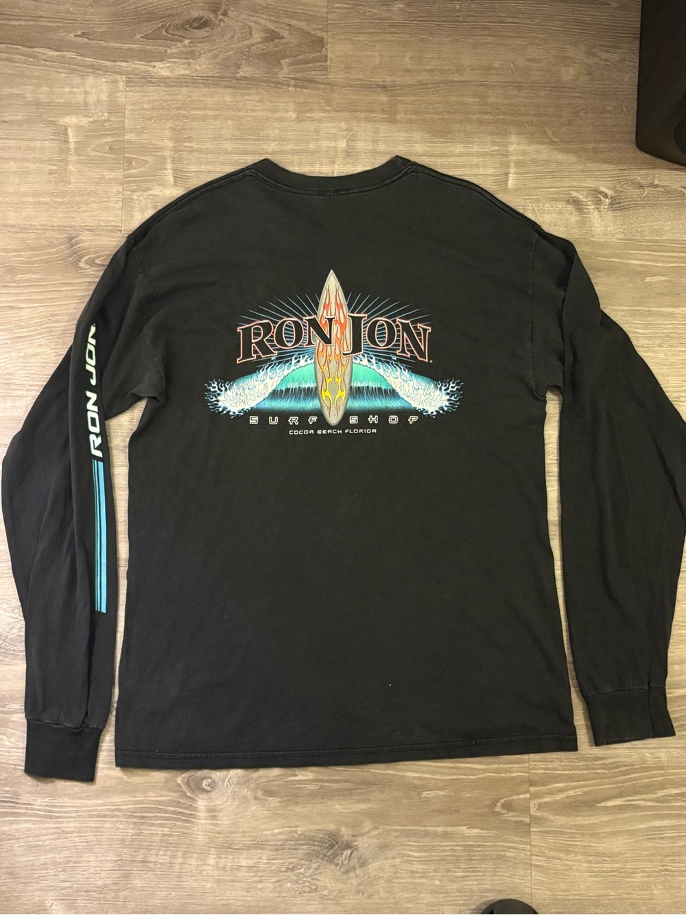 Ron Jon Black Long Sleeve Tee with Surfboard & Turquoise Wave Graphic